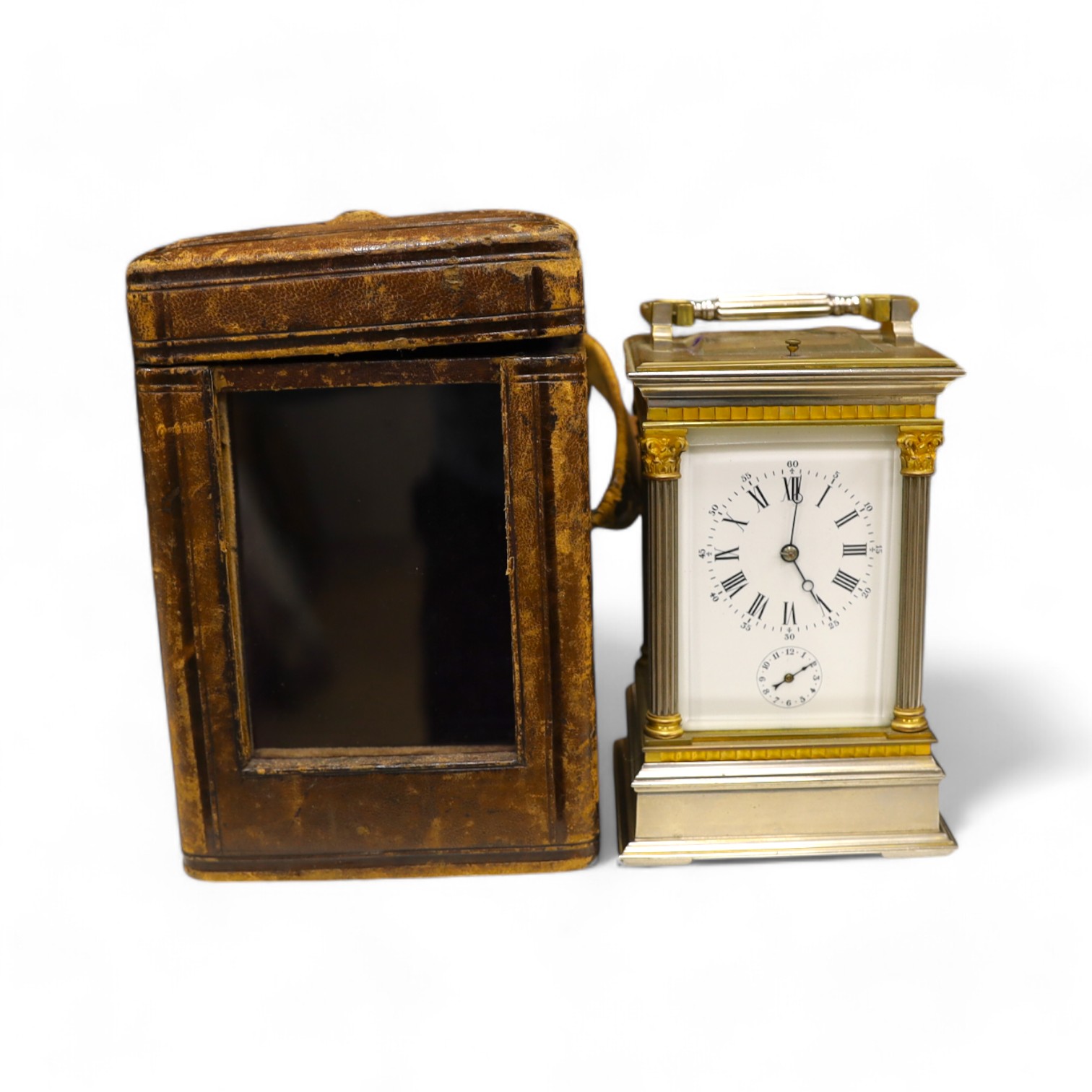 A carriage clock, in leather case, 18cm high. Condition - gilding worn and surface slightly pitted in places